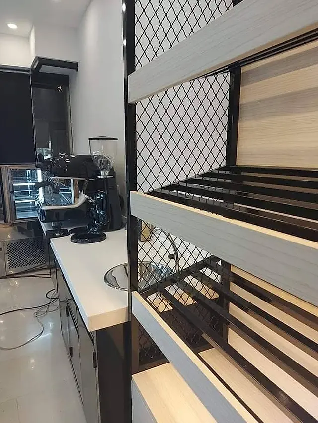 Cafe: Bar counter with espresso machine and shelving