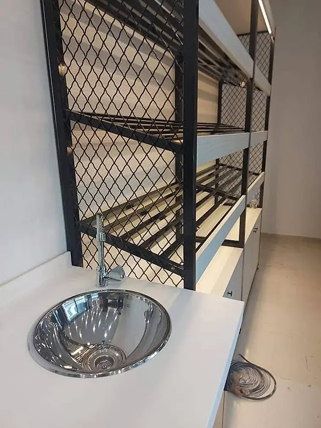 Bakery: Stainless steel sink and bread shelving
