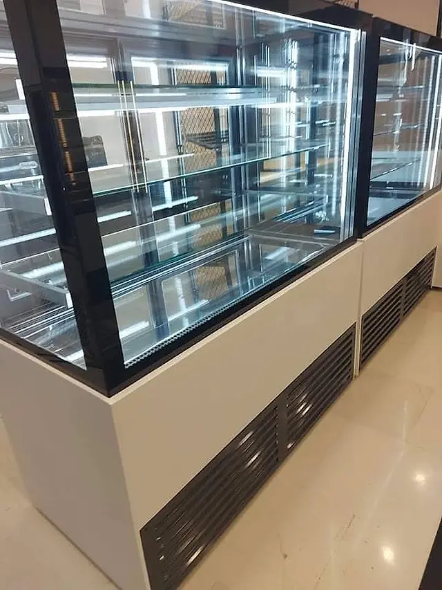 Bakery: Refrigerated dessert display cases in a row
