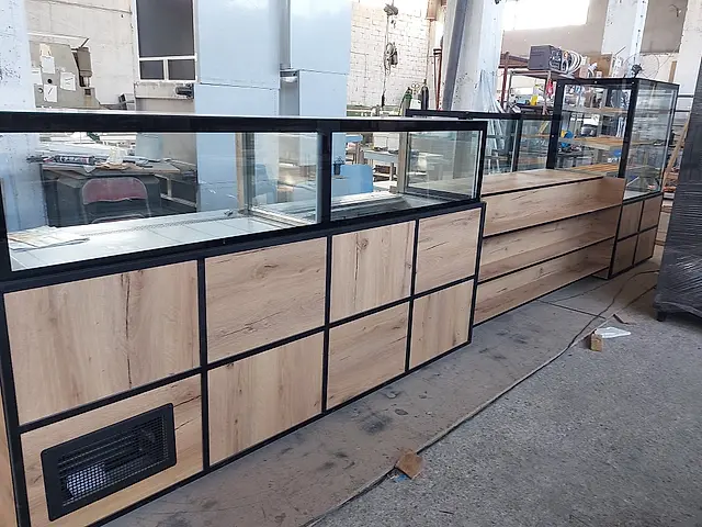 Production: Refrigerated display cases with wood finish