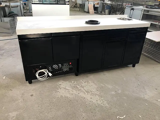 Cafe bar: Black counter fridge with white worktop